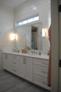 Mt. Pleasant, Master Bathroom with double sink vanity cabinets and custom countertop.  Electrical plug in top drawers. Shiplap finished walls with custom mirror.