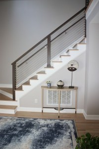 G & J Remodeled entry with cable railing and custom stained rails and Newel posts