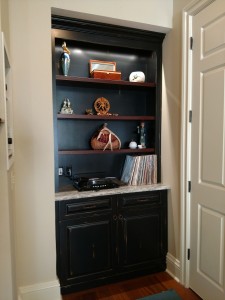 Drew, custom hallway cabinet with shelving and custom stone countertop.