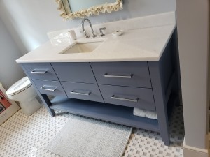 Kiawah Custom vanity, with custom drawers and lower shelf.  Sherwin Williams Bracing Blue color cabinets with chrome handles