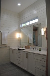 Mt. Pleasant, Master Bathroom with double sink vanity cabinets and custom countertop.  Electrical plug in top drawers. Shiplap finished walls with custom mirror.