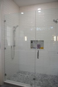 Mt. Pleasant, Master Bathroom custom walk-in shower with subway style white wall tiles and grey marble hexagonal floor tiles. Moen 90 Degree square showerhead.  Moen 90 Degree hand-held shower head.   